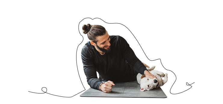 Person with dog on yoga mat